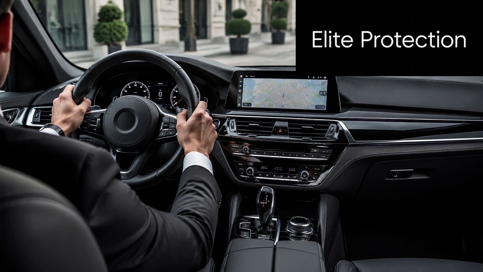 A professional in a suit driving a luxury car with advanced navigation systems and monitoring technology.